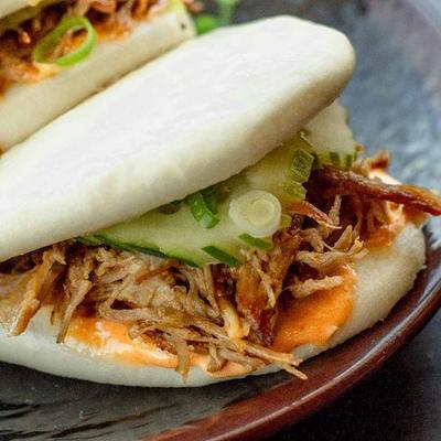 Steamed bun filled with pork and fresh vegetables
